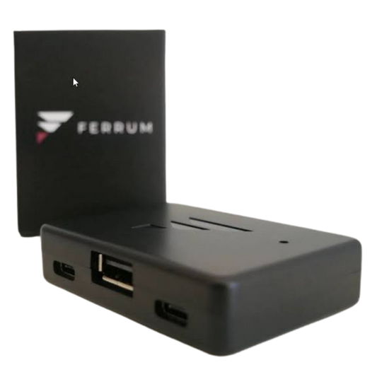 Ferrum One 8000 Hz USB input device with its box, showing the USB-A port and two USB-C ports