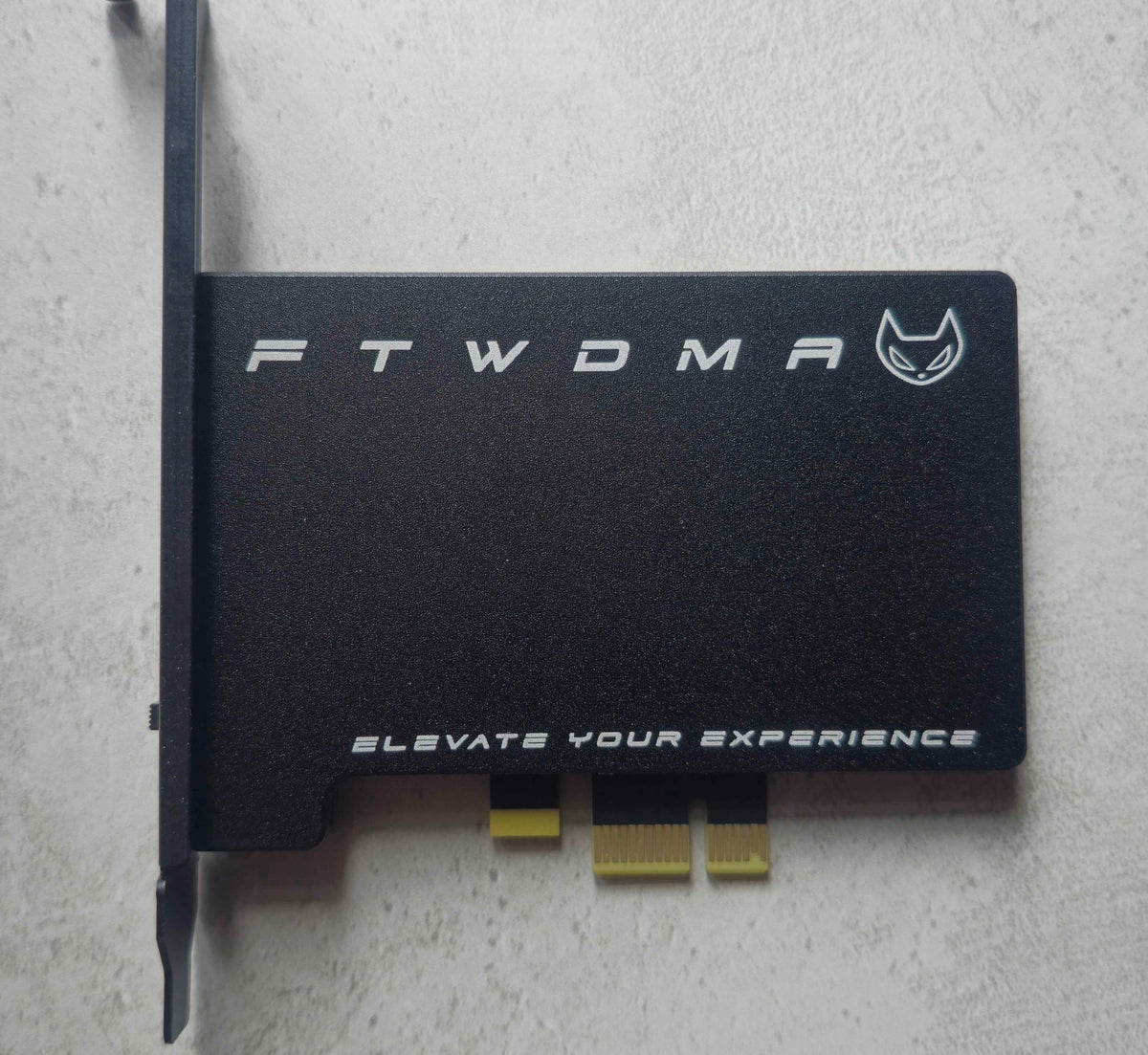 FTW DMA 100T Black Edition Artix-7 100T PCIe DMA card, front view of the black shroud and full-height bracket